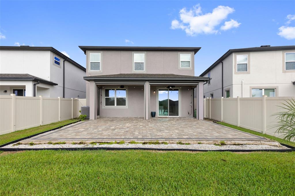 7537 Pool Compass Loop Wesley Chapel, FL 33545 - Photo 46 of 50 a house with swimming pool in front of it