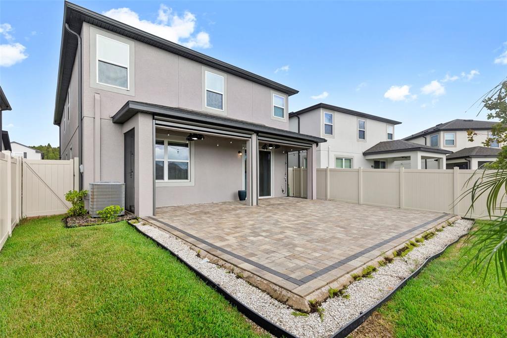 7537 Pool Compass Loop Wesley Chapel, FL 33545 - Photo 47 of 50 a view of a backyard of a house