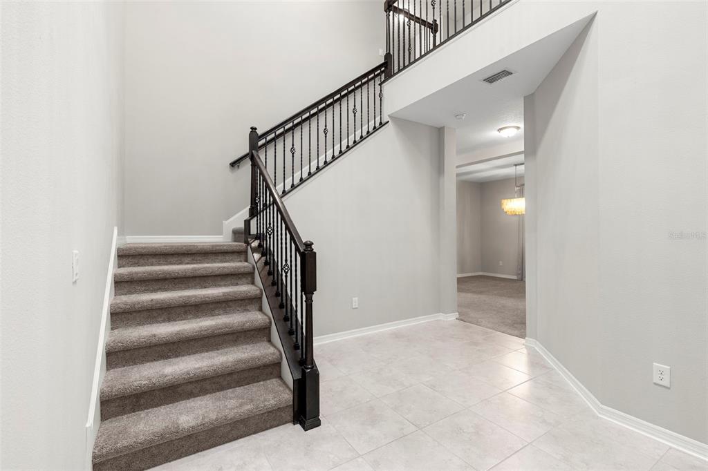 7537 Pool Compass Loop Wesley Chapel, FL 33545 - Photo 6 of 50 a view of entryway and hall with a floor
