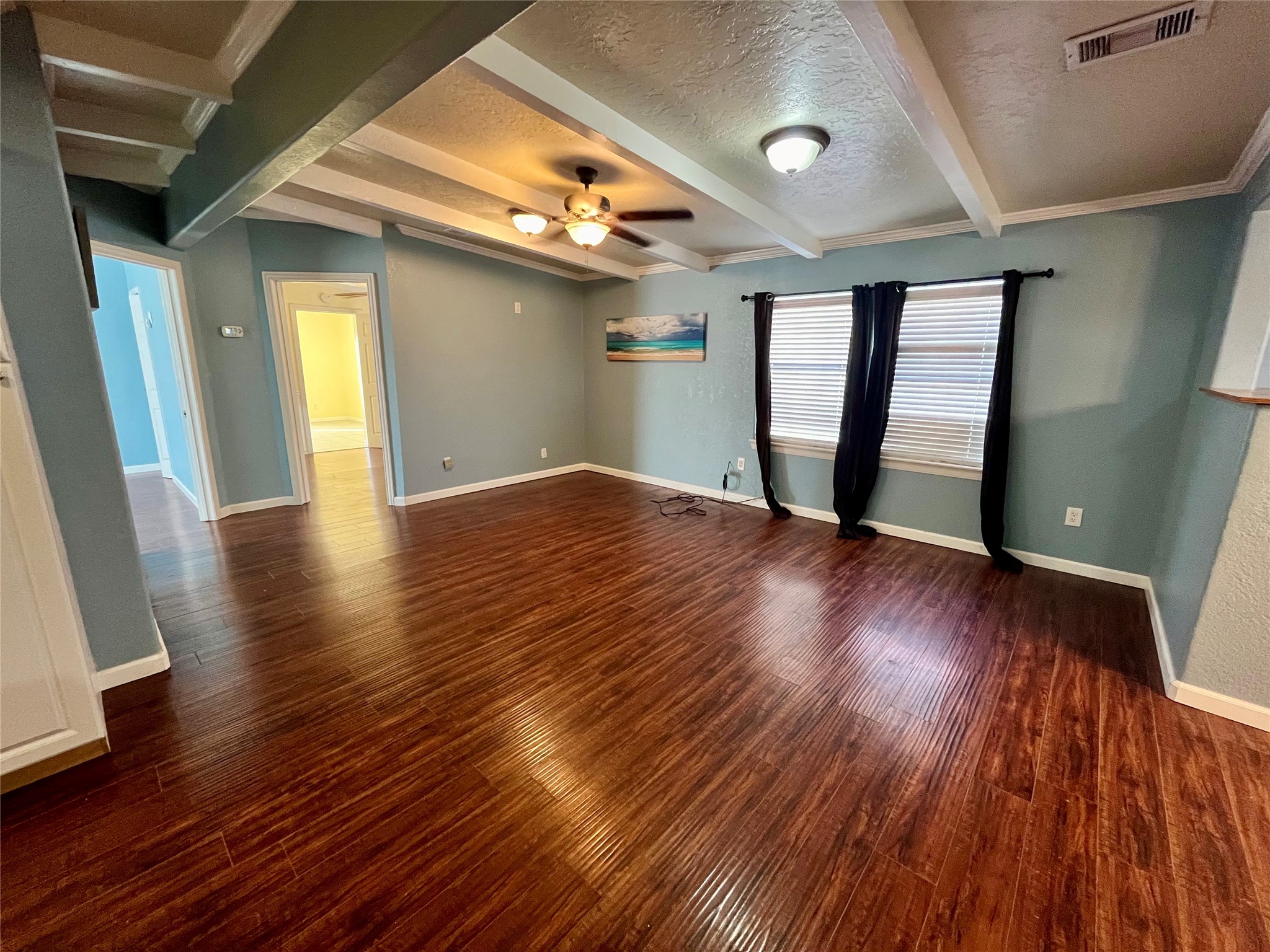 318 Marine Way Freeport, TX 77541 - Photo 4 of 20 a view of an empty room with wooden floor and a window
