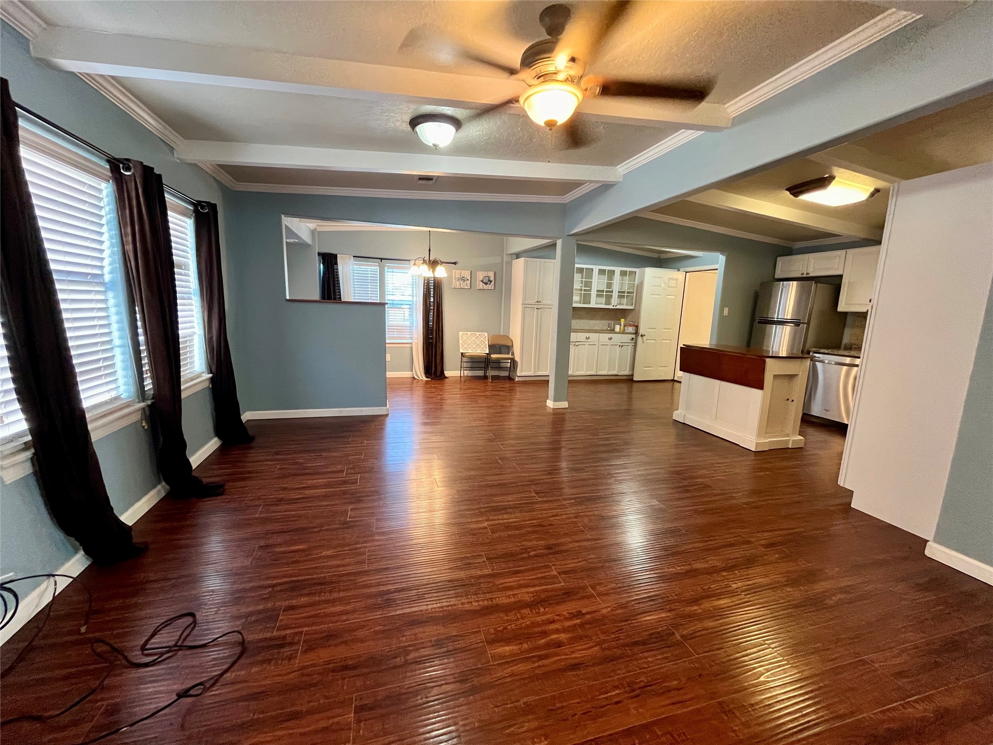 318 Marine Way Freeport, TX 77541 - Photo 5 of 20 a view of an empty room with wooden floor and windows