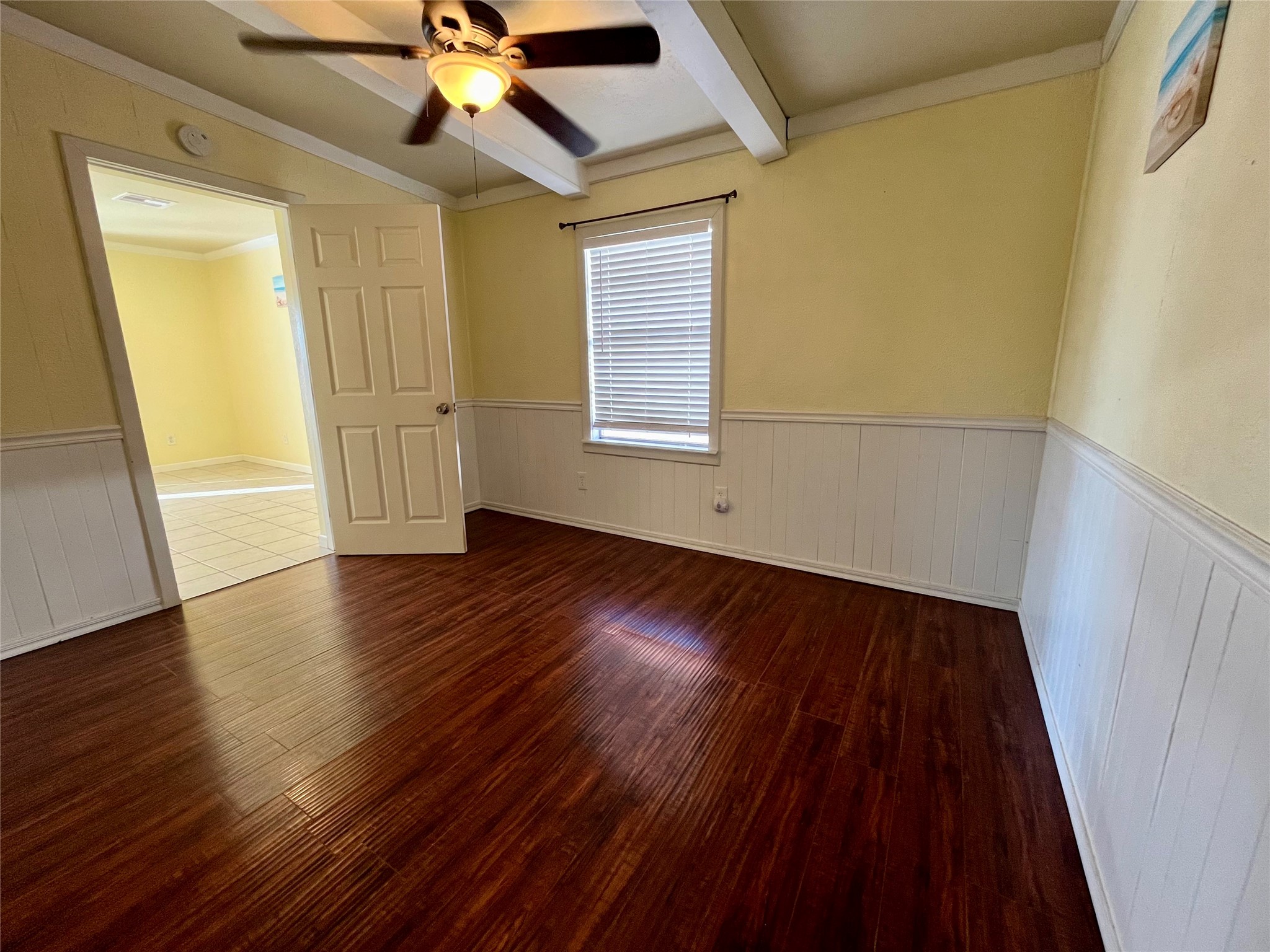 318 Marine Way Freeport, TX 77541 - Photo 8 of 20 a view of an empty room with wooden floor and a window