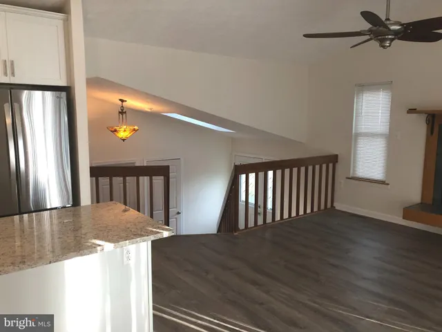 a view of wooden floor and a living room