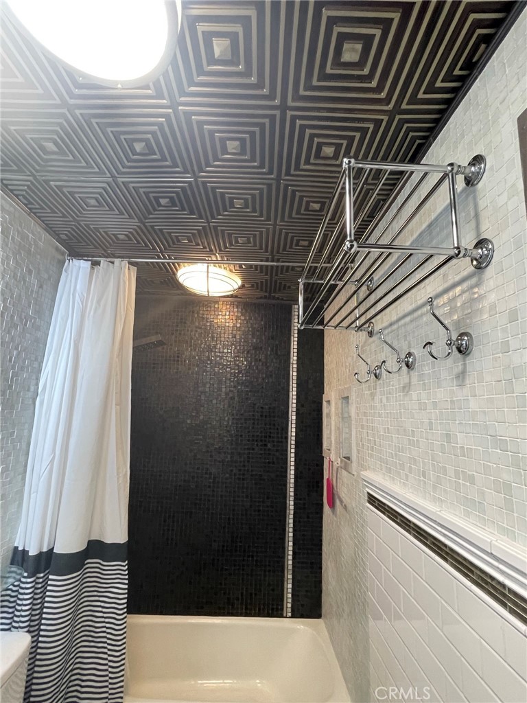 1187 East 3rd Street, Unit 209 Long Beach, CA 90802 - Photo 15 of 34 COFFERED CEILING IN BATH, ARTFUL CUSTOMIZED TILE.