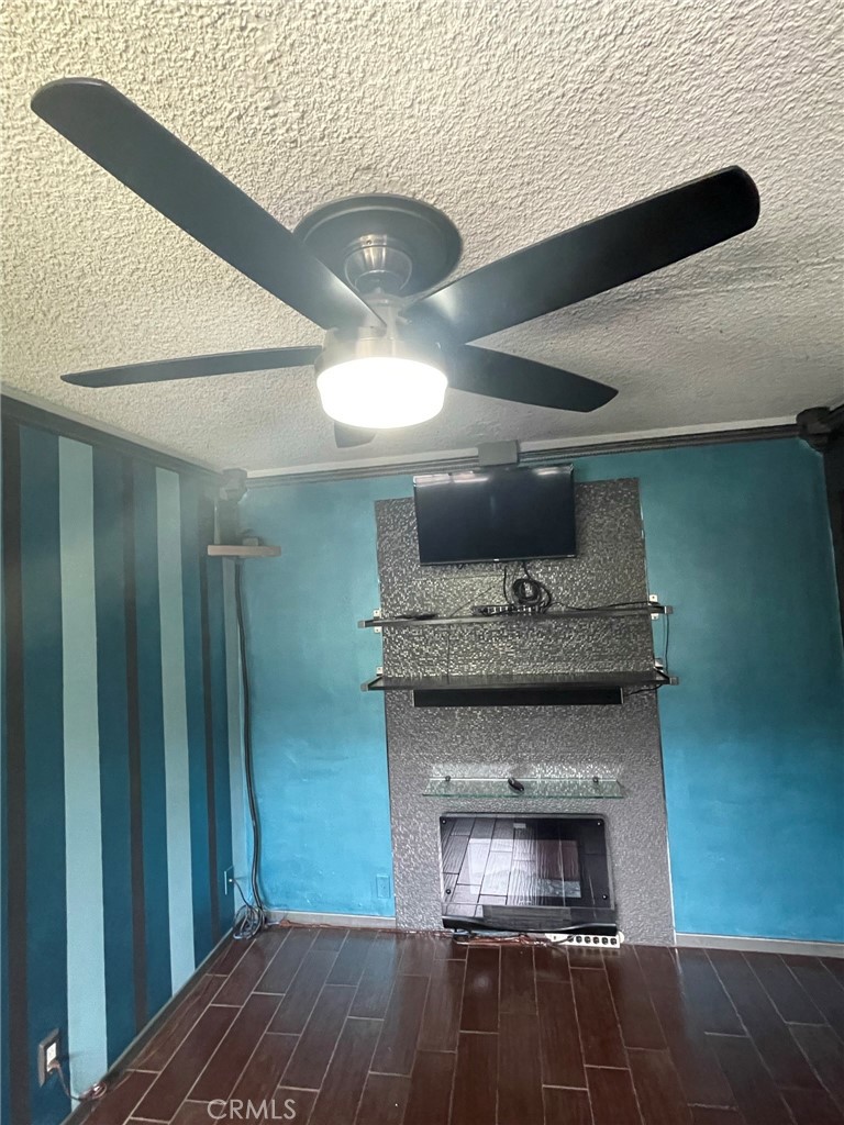 1187 East 3rd Street, Unit 209 Long Beach, CA 90802 - Photo 19 of 34 BEDROOM INCLUDES FLAT SCREEN TV AND "FAUX" FIREPLACE