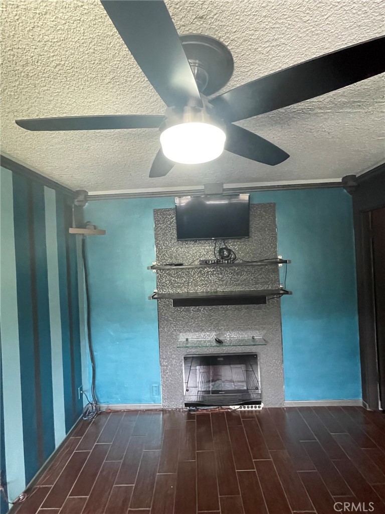 1187 East 3rd Street, Unit 209 Long Beach, CA 90802 - Photo 20 of 34 BEDROOM CEILING FAN AND RICH LAMINATE FLOOR