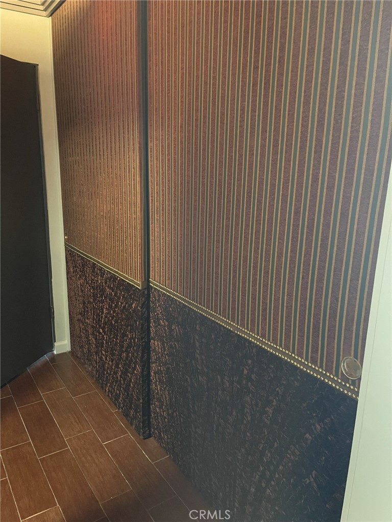 1187 East 3rd Street, Unit 209 Long Beach, CA 90802 - Photo 27 of 34 ANOTHER CLOSET WITH TEXTURED FABRIC FINISH