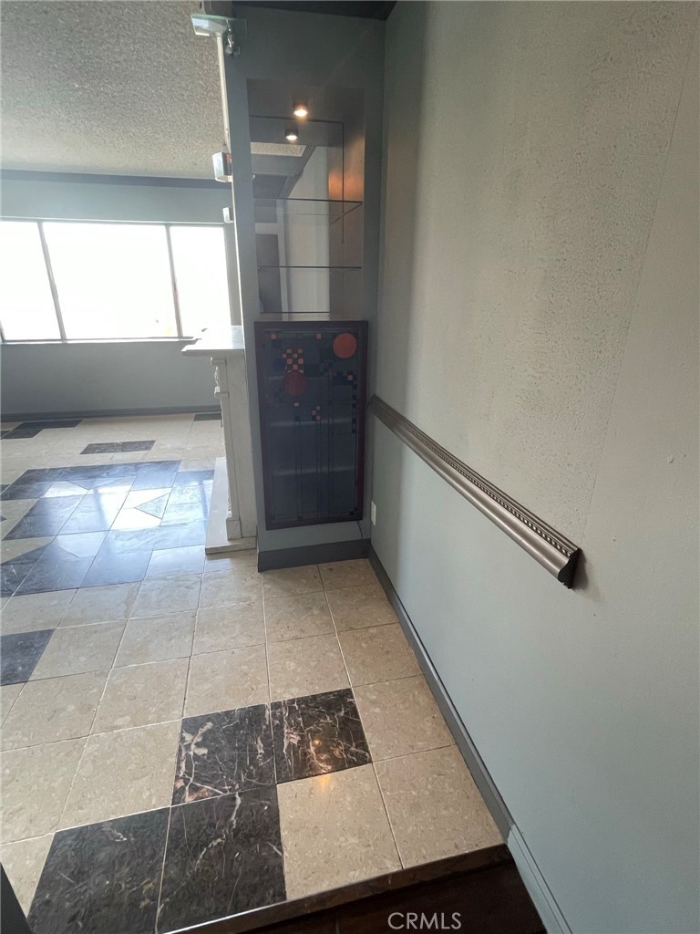 1187 East 3rd Street, Unit 209 Long Beach, CA 90802 - Photo 30 of 34 BEHIND THE FIREPLACE STORAGE FOR VIDEO-AUDIO EQUIPMENT.