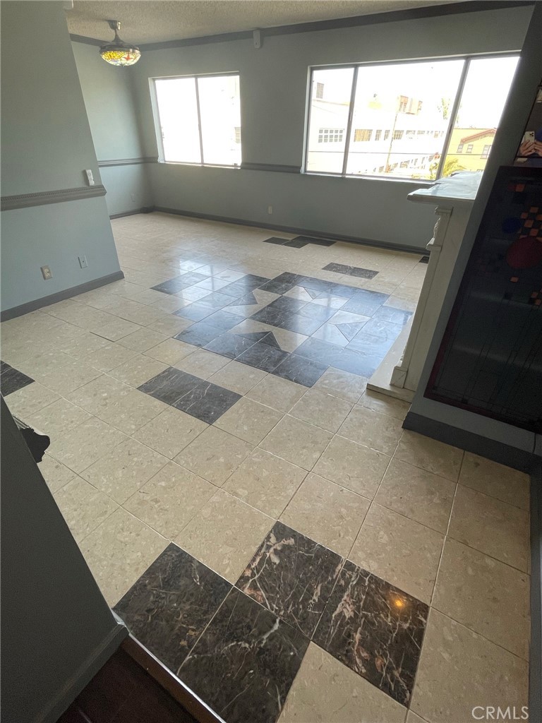 1187 East 3rd Street, Unit 209 Long Beach, CA 90802 - Photo 31 of 34 MARBLE FLOORING, CHAIR RAIL AND CROWN MOLDING