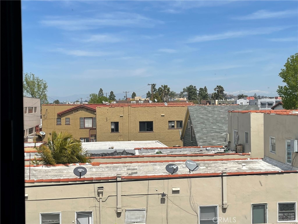 1187 East 3rd Street, Unit 209 Long Beach, CA 90802 - Photo 32 of 34 VIEW NORTH BEYOND SIGNAL HILL WITH SNOW CAPPED MOUNTAINS (now)