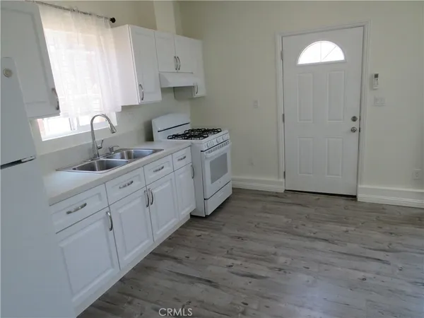 a view of a kitchen with cabinets