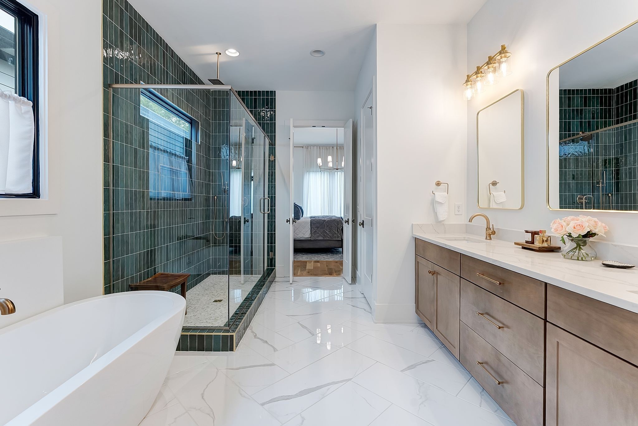 3733 Estes Road Nashville, TN 37215 - Photo 12 of 40 a spacious en suite bathroom with a tub mirror and shower