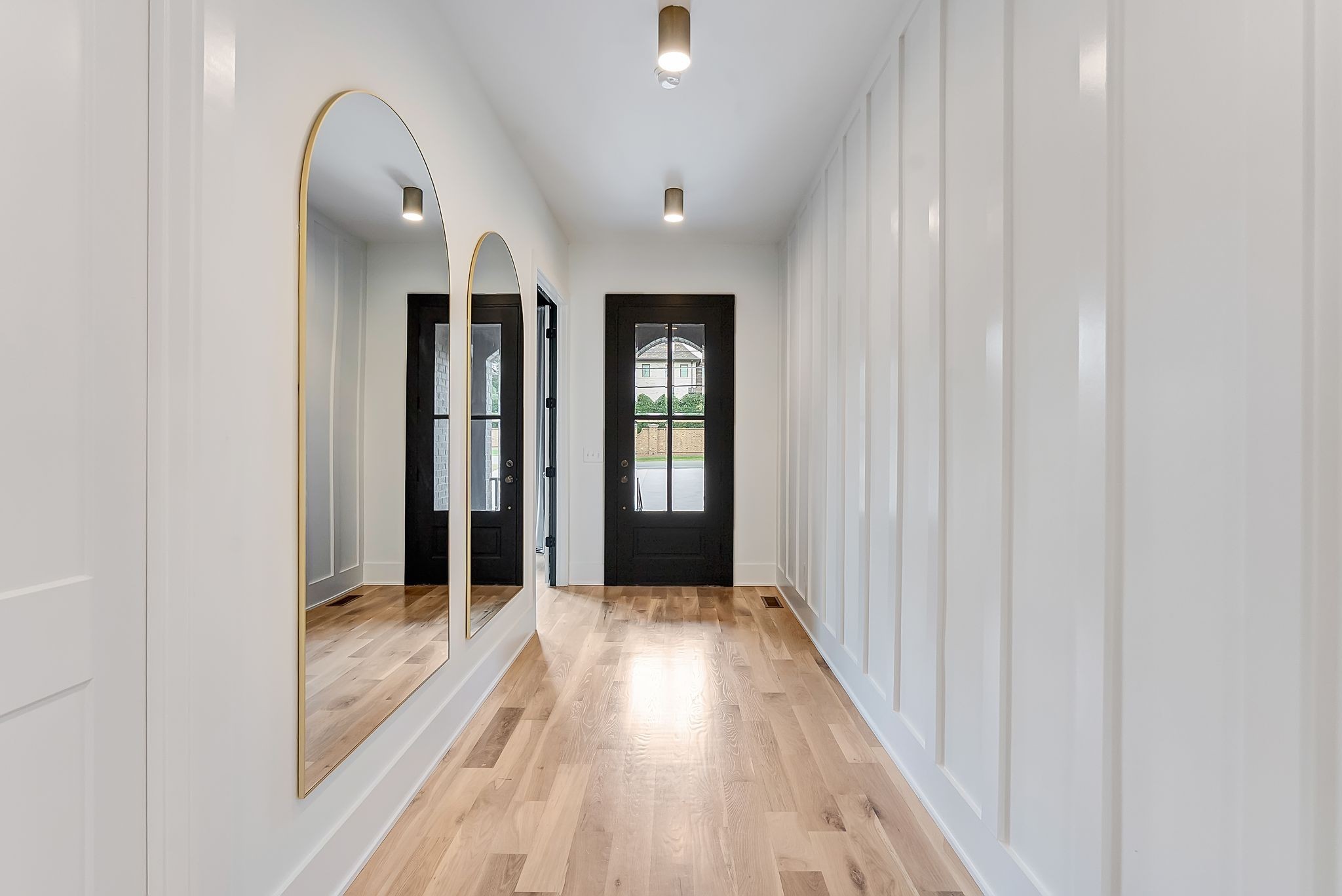 3733 Estes Road Nashville, TN 37215 - Photo 3 of 40 a view of a hallway with wooden floor and staircase
