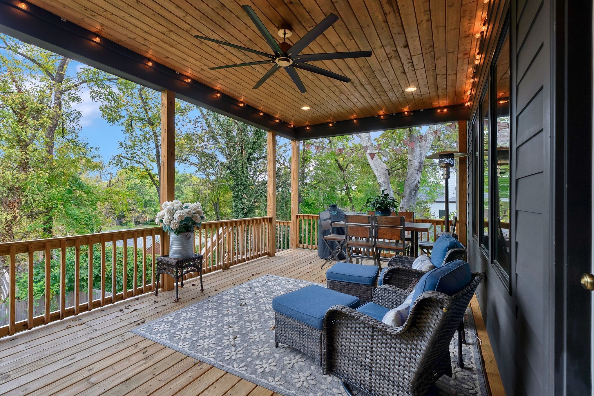3733 Estes Road Nashville, TN 37215 - Photo 37 of 40 a view of a patio with couches chairs potted plants and wooden floor