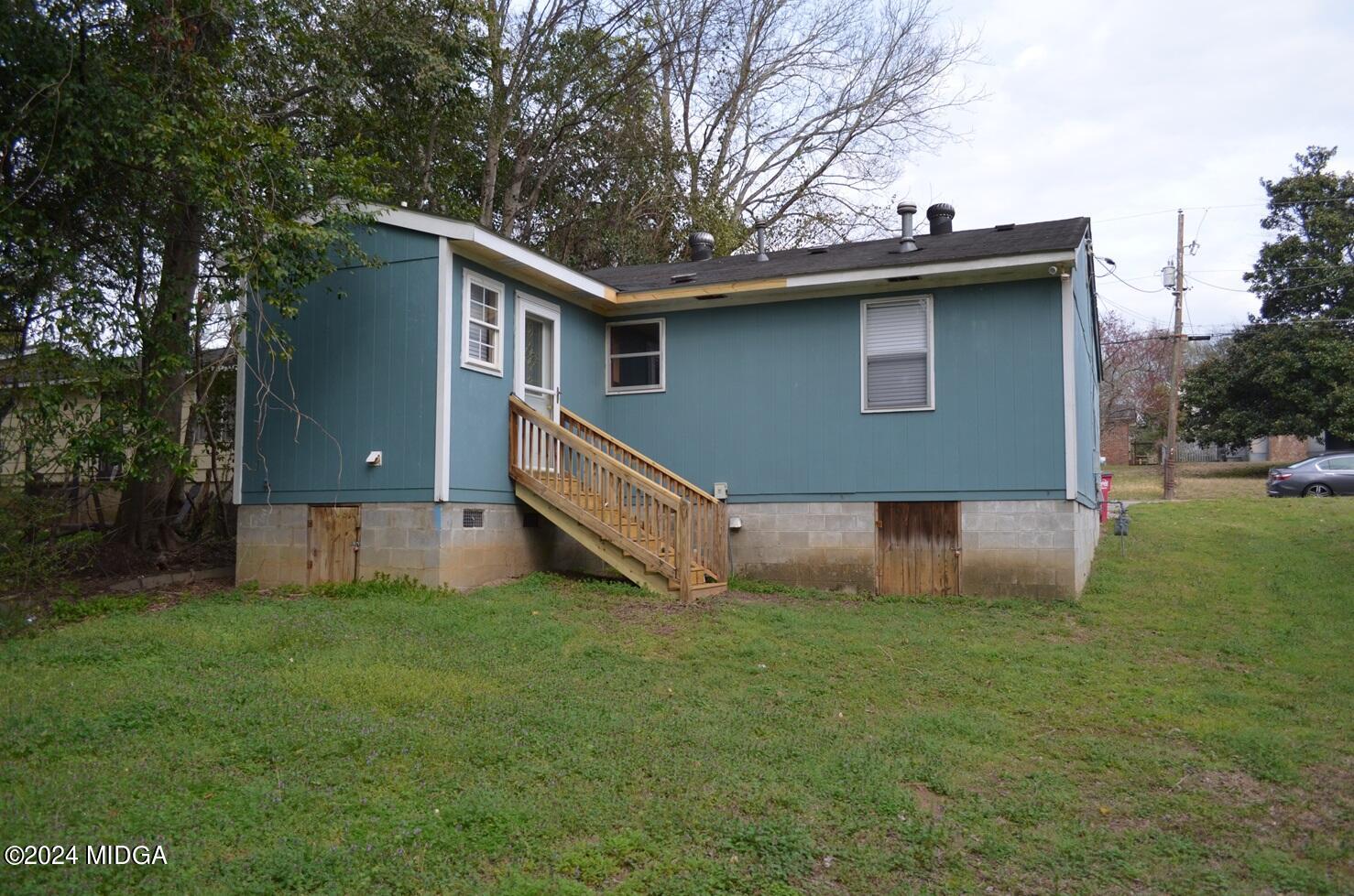 3910 Thompson Road Macon, GA 31204 - Photo 13 of 16 a view of a house with a yard