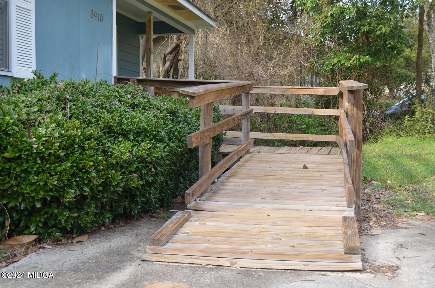 3910 Thompson Road Macon, GA 31204 - Photo 2 of 16 a pathway of a house with a yard