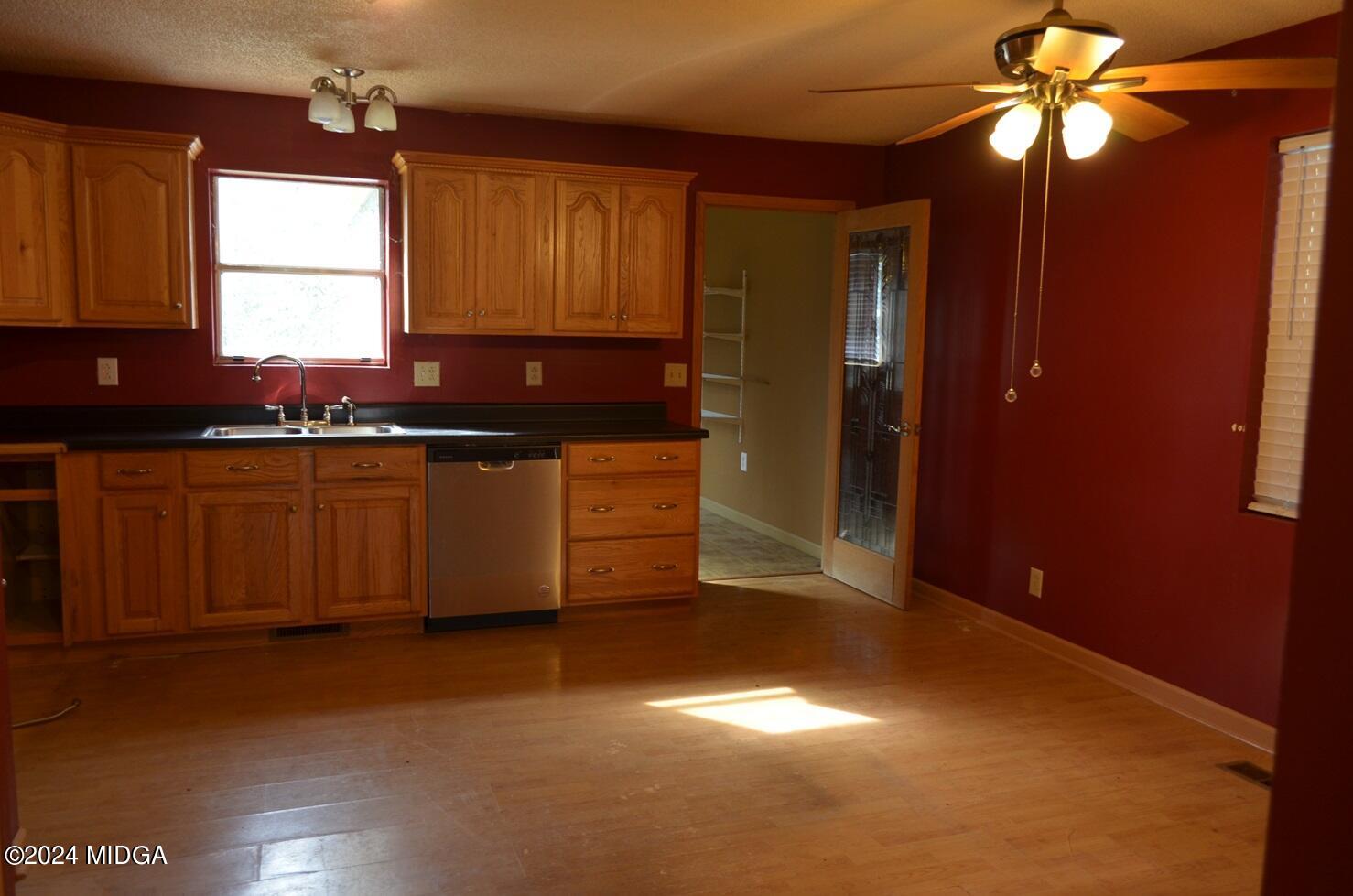 3910 Thompson Road Macon, GA 31204 - Photo 6 of 16 a kitchen with stainless steel appliances granite countertop a sink a stove and a refrigerator