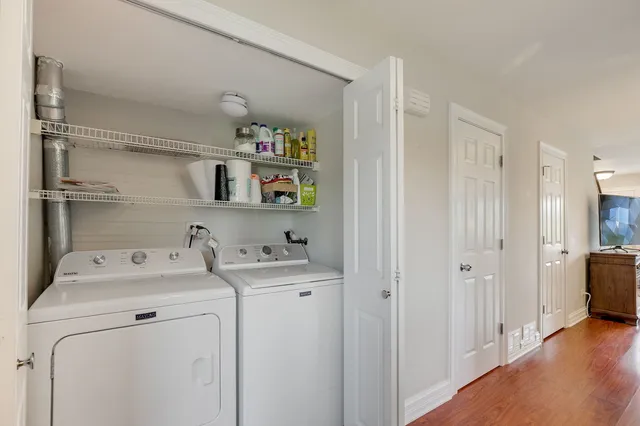 a utility room with sink dryer and washer