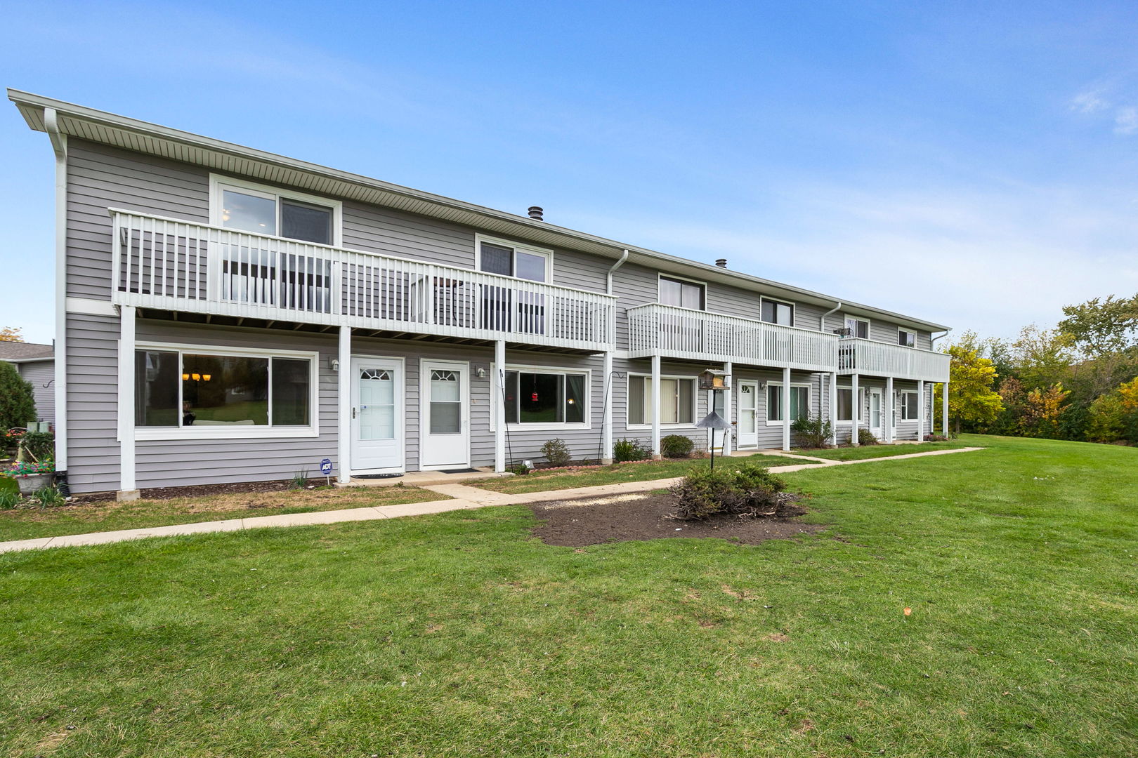 17438 Walnut Lane Gurnee, IL 60031 - Photo 14 of 17 a front view of a house with a garden