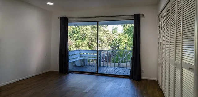 a view of a terrace space with wooden floor and city view