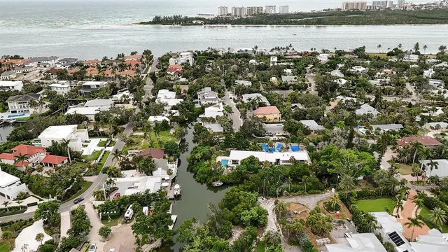 an aerial view of a house with a yard and garden