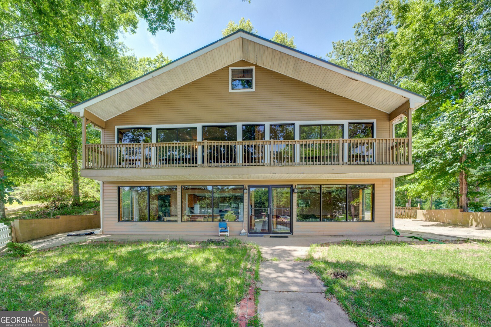 a front view of a house with a yard and porch