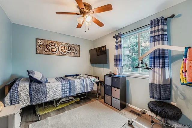 a bedroom with furniture and a window