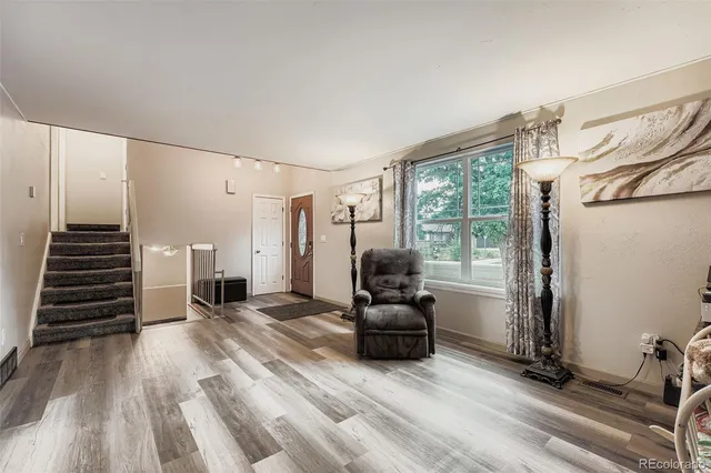 a view of livingroom with furniture and staircase
