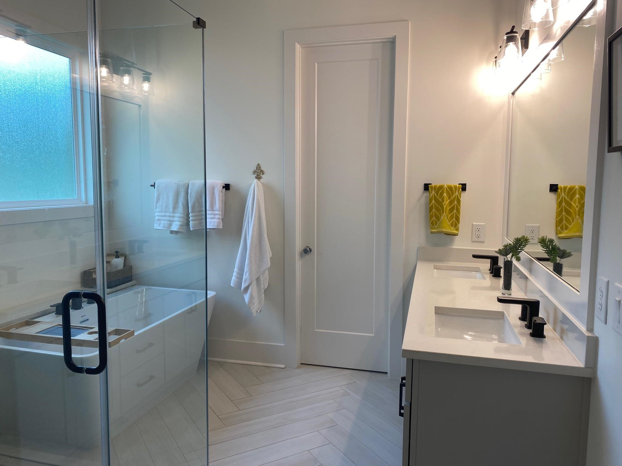 4408 Duraleigh Road Raleigh, NC 27612 - Photo 14 of 21 a bathroom with a sink a faucet a mirror and a shower