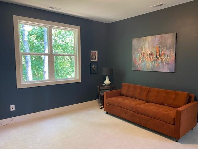 4408 Duraleigh Road Raleigh, NC 27612 - Photo 16 of 21 a living room with furniture and a window