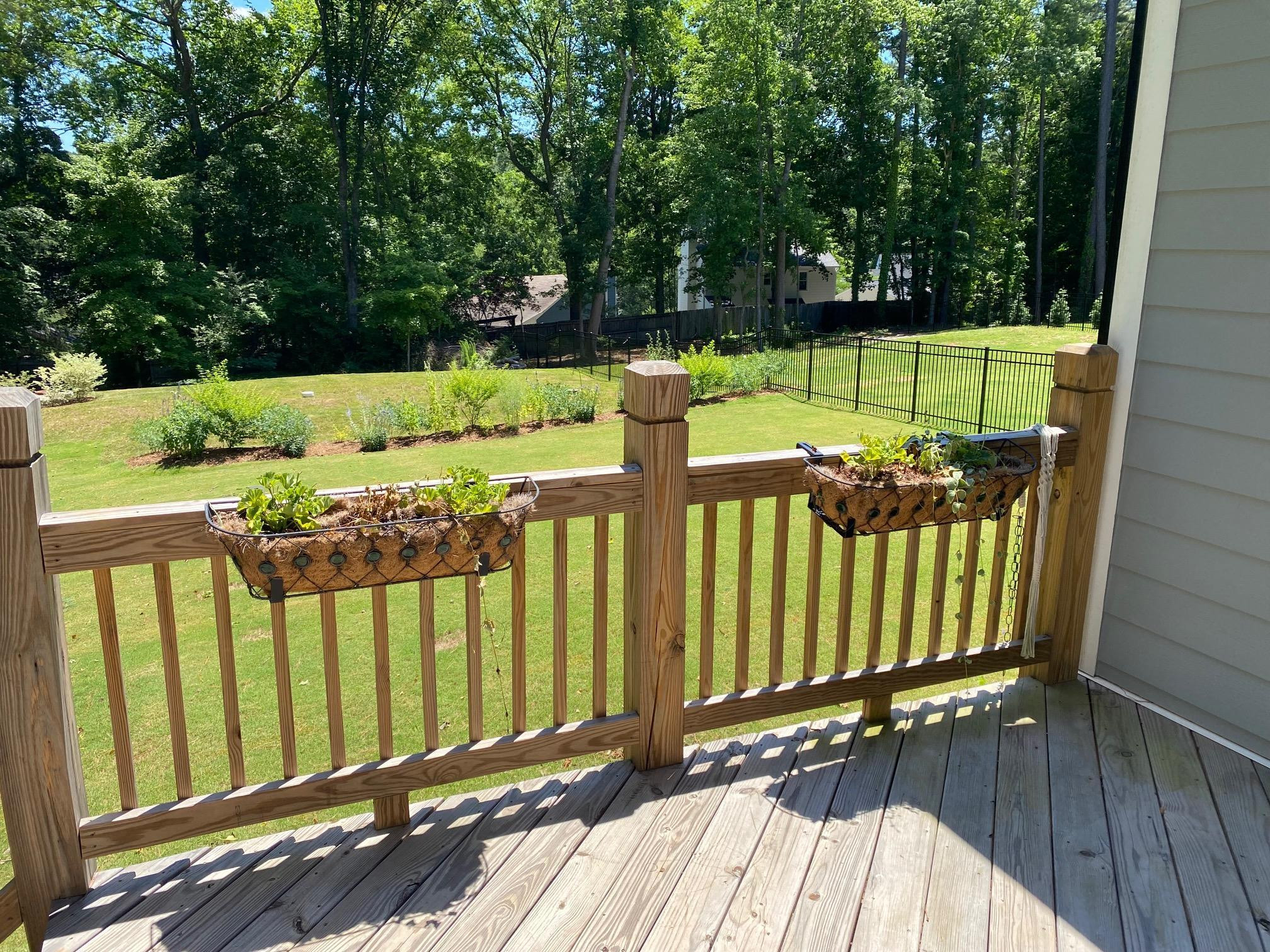 4408 Duraleigh Road Raleigh, NC 27612 - Photo 17 of 21 a view of a pathway of a wooden deck