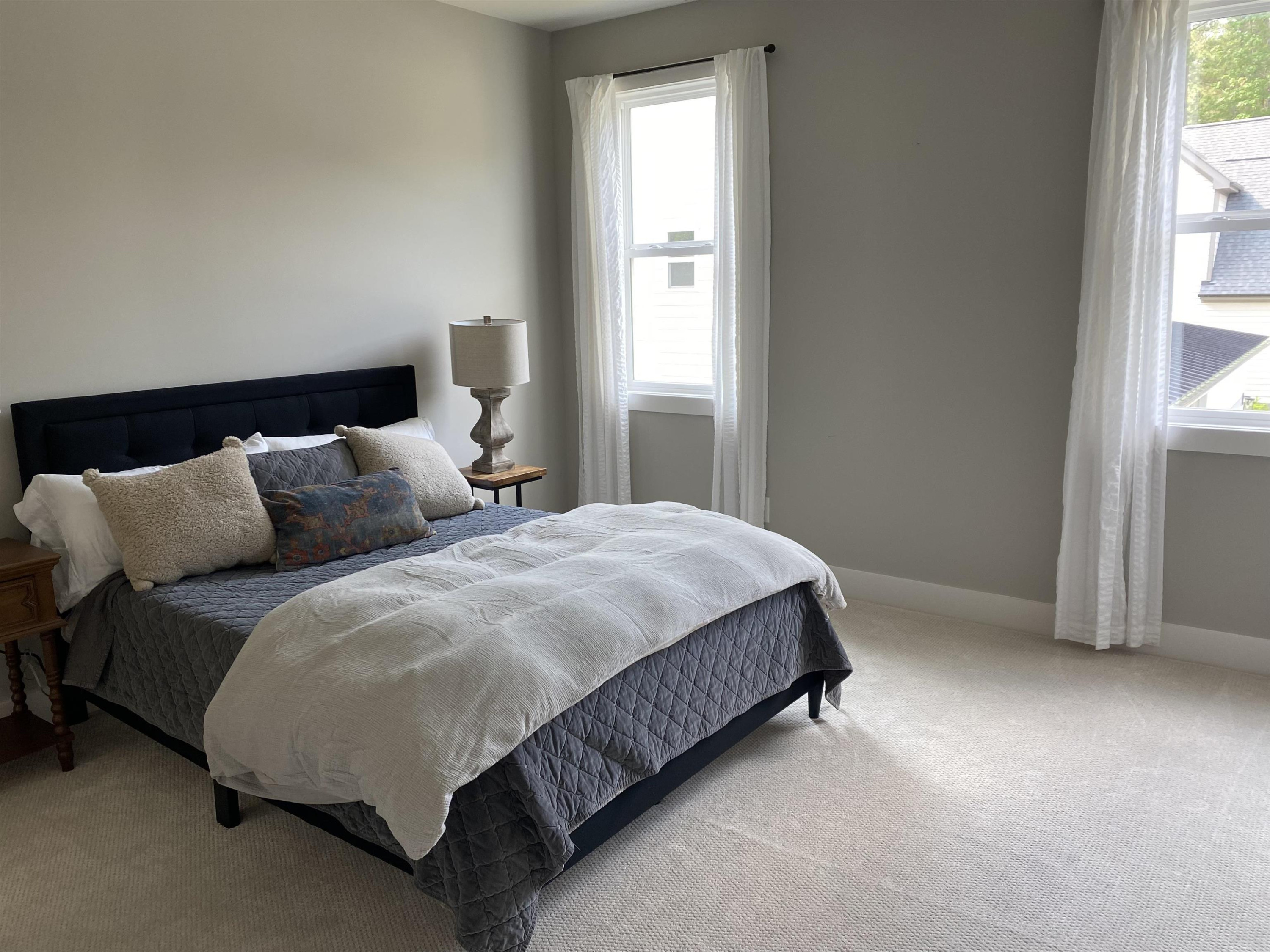 4408 Duraleigh Road Raleigh, NC 27612 - Photo 20 of 21 a bedroom with a bed and a window