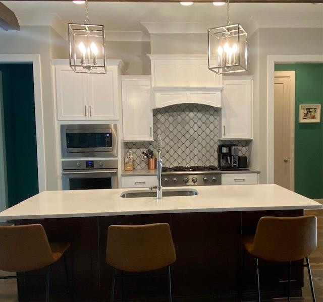 4408 Duraleigh Road Raleigh, NC 27612 - Photo 8 of 21 a kitchen with stainless steel appliances a table chairs and chandelier