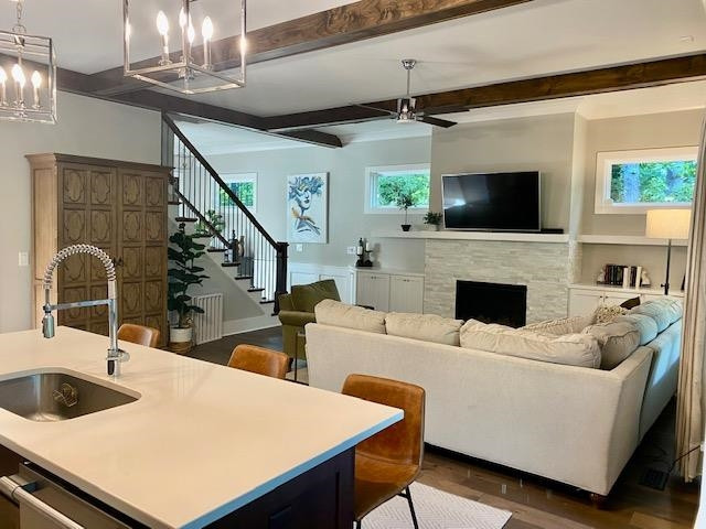 4408 Duraleigh Road Raleigh, NC 27612 - Photo 9 of 21 a living room with furniture and a fireplace