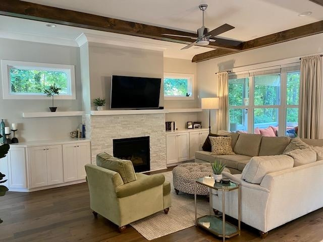 4408 Duraleigh Road Raleigh, NC 27612 - Photo 10 of 21 a living room with furniture a flat screen tv and a fireplace