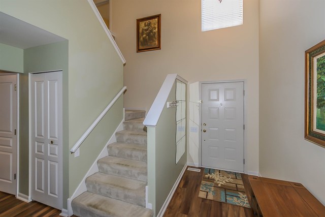 302 Locksley Drive Streamwood, IL 60107 - Photo 12 of 23 a view of a hallway with wooden floor and entryway