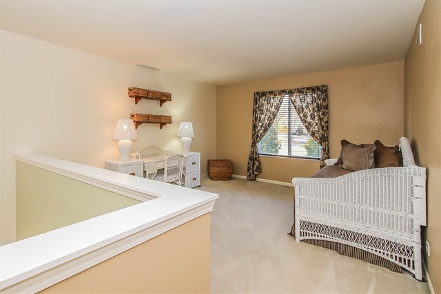 302 Locksley Drive Streamwood, IL 60107 - Photo 13 of 23 a bedroom with furniture and a window