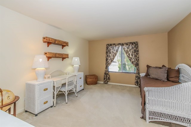 302 Locksley Drive Streamwood, IL 60107 - Photo 14 of 23 a bedroom with furniture and a window