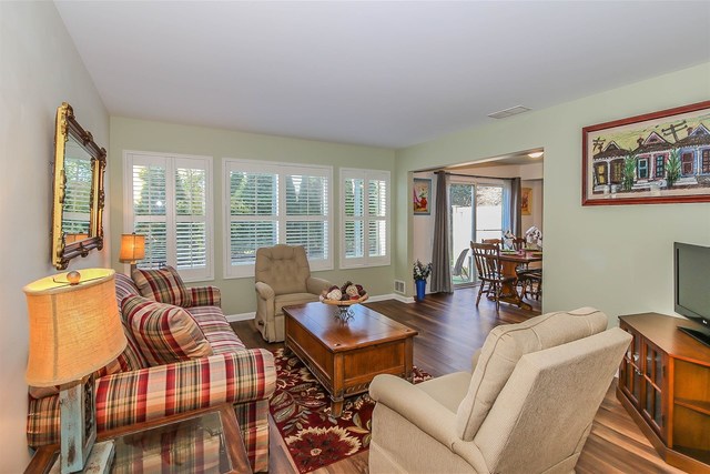 302 Locksley Drive Streamwood, IL 60107 - Photo 3 of 23 a living room with furniture and a floor to ceiling window