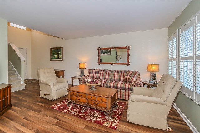302 Locksley Drive Streamwood, IL 60107 - Photo 4 of 23 a living room with furniture and a fireplace