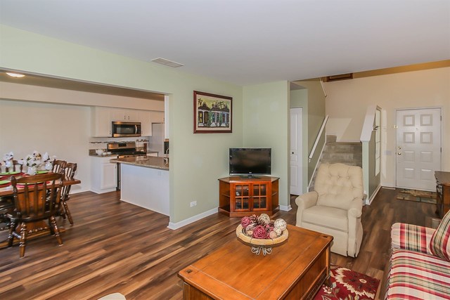 302 Locksley Drive Streamwood, IL 60107 - Photo 5 of 23 a living room with furniture and wooden floor