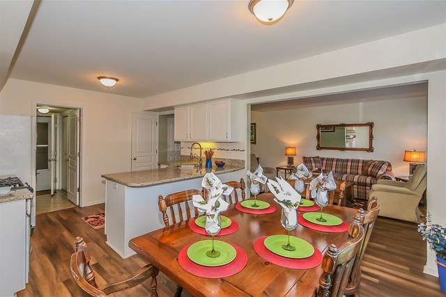 302 Locksley Drive Streamwood, IL 60107 - Photo 7 of 23 a dining room with lots of furniture and wooden floor