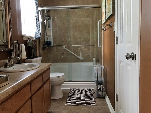 4967 Fulton Mill Road Macon, GA 31216 - Photo 15 of 28 a bathroom with a sink toilet and shower