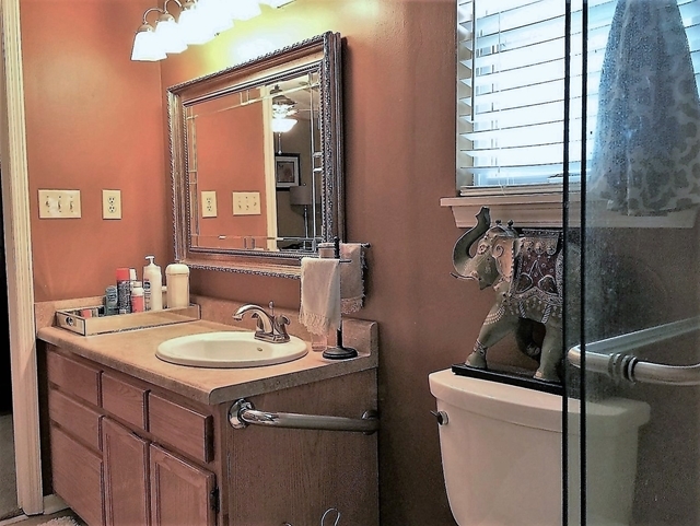 4967 Fulton Mill Road Macon, GA 31216 - Photo 16 of 28 a bathroom with a sink and a toilet