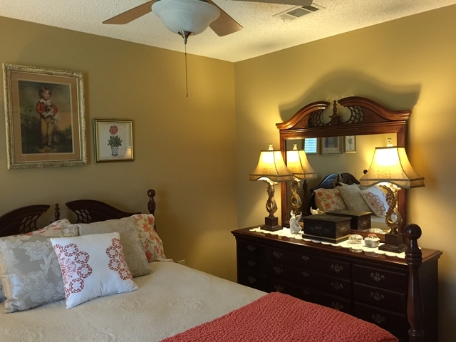 4967 Fulton Mill Road Macon, GA 31216 - Photo 18 of 28 a bedroom with a bed and wooden floor
