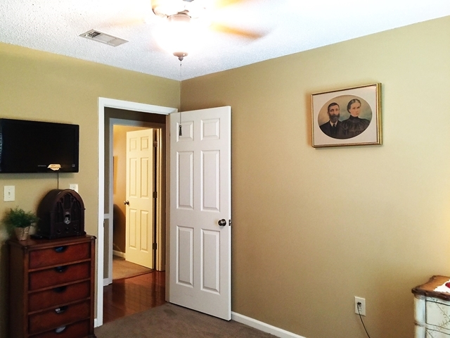 4967 Fulton Mill Road Macon, GA 31216 - Photo 20 of 28 a view of a livingroom with a flat screen tv