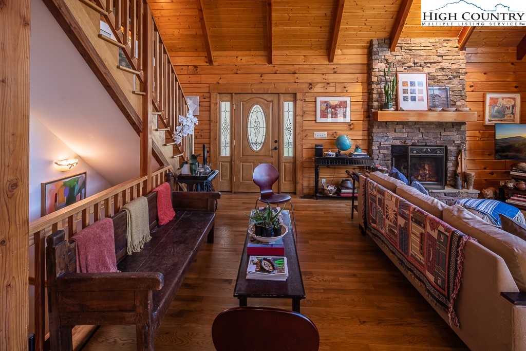 154 Lilac Lane Boone, NC 28607 - Photo 15 of 50 a living room with furniture fireplace dining table and a fireplace