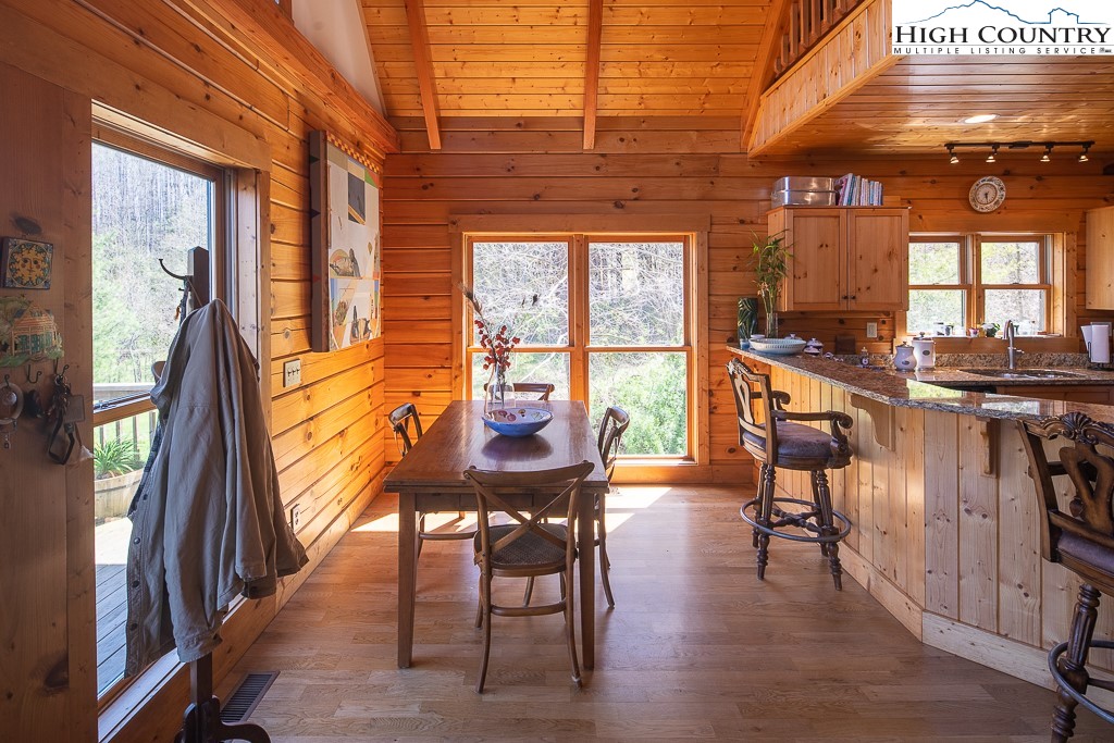 154 Lilac Lane Boone, NC 28607 - Photo 16 of 50 a view of a dining room with furniture window and outside view