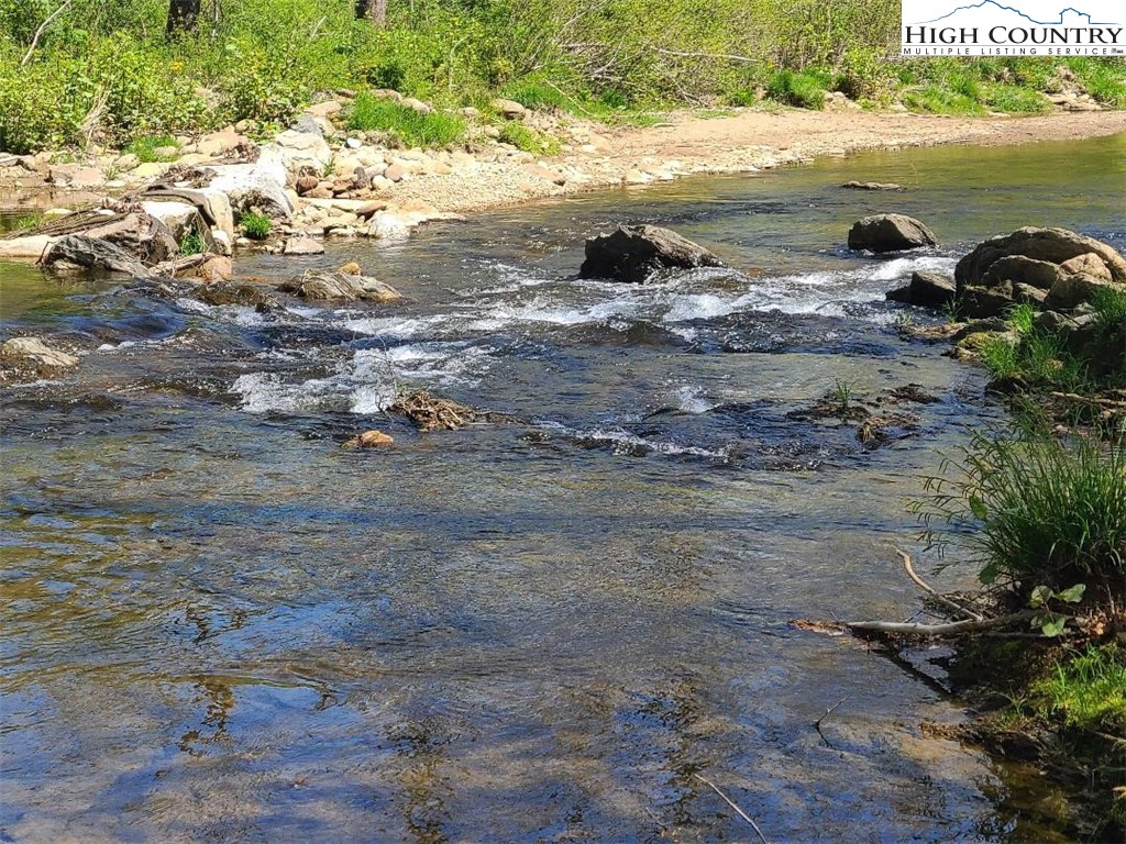 154 Lilac Lane Boone, NC 28607 - Photo 2 of 50 a view of a lake with beach