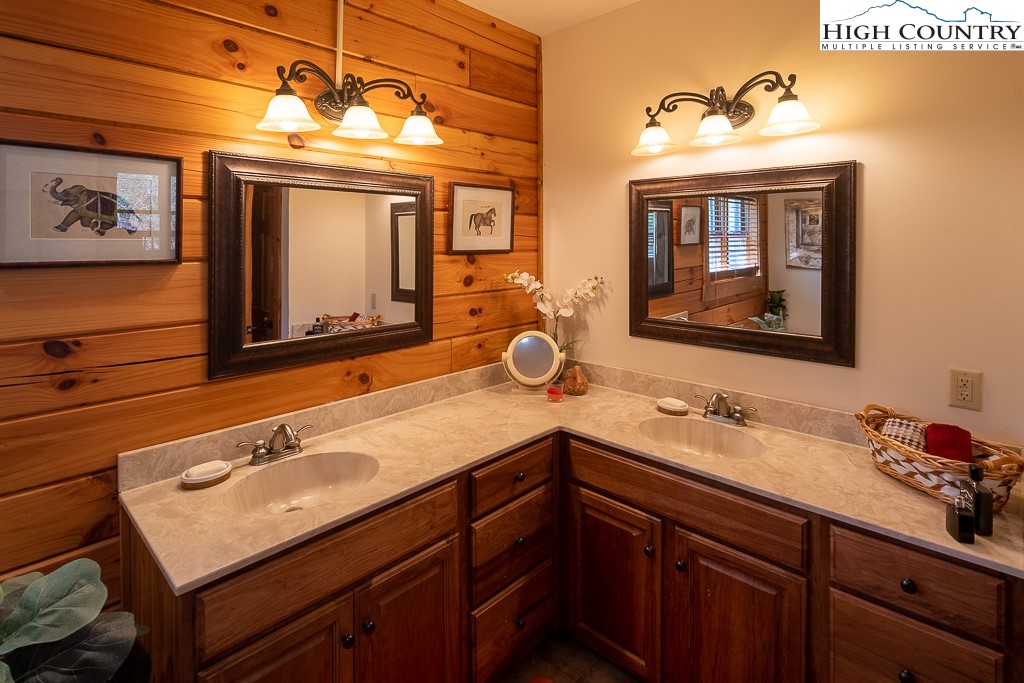 154 Lilac Lane Boone, NC 28607 - Photo 25 of 50 a bathroom with a sink double vanity and a mirror